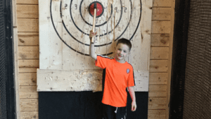 Youth throwing a bullseye