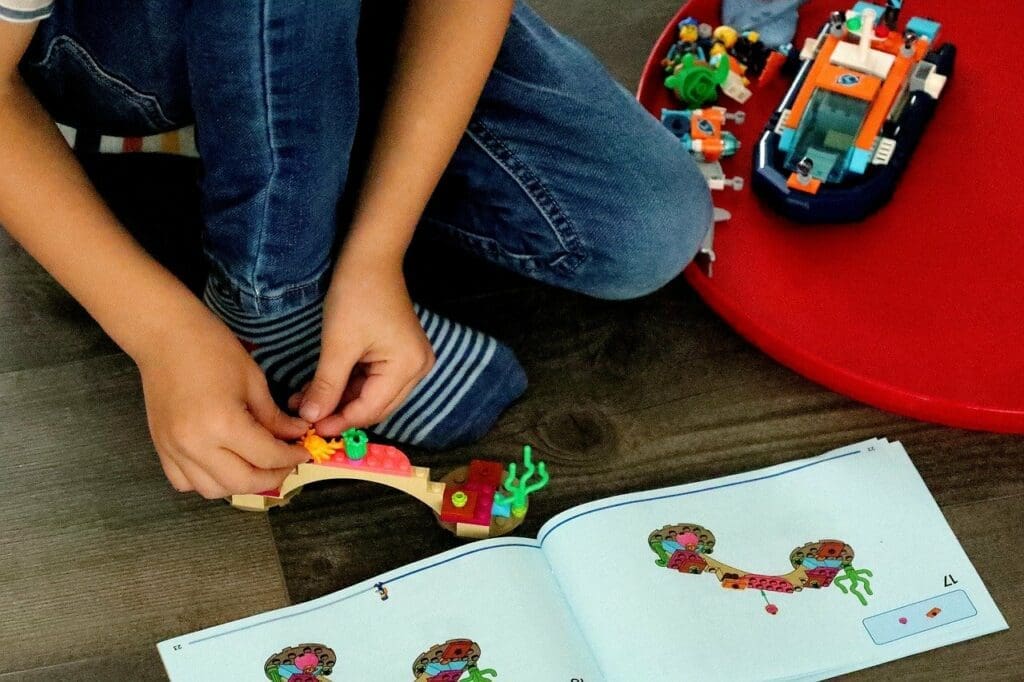 Child building a LEGO activity in Columbus. 